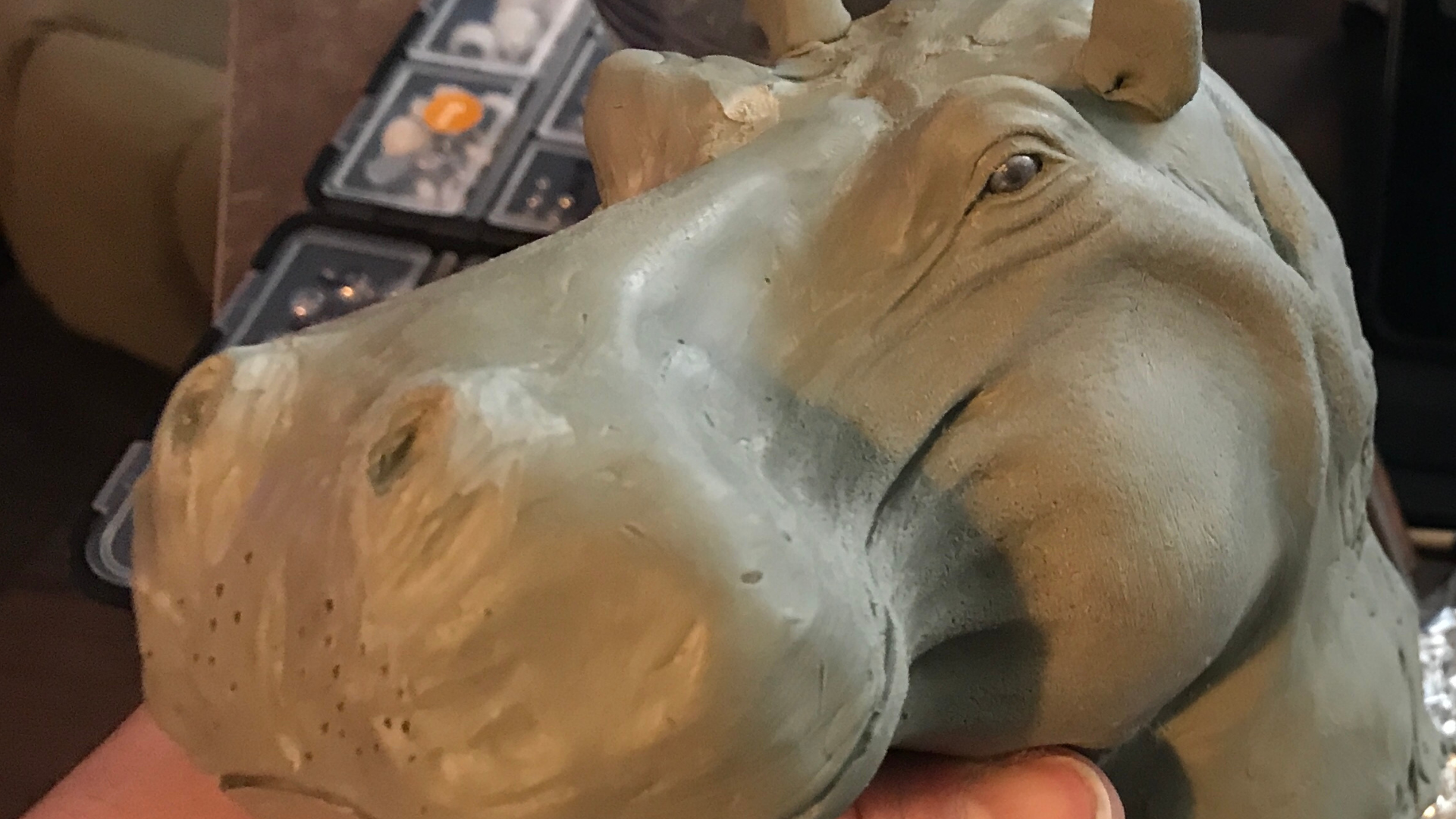 Load video: Sculpting demonstration of making a hippo head out of clay